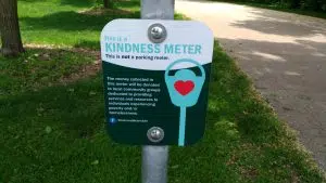 A small sign attached to every Kindness Meter