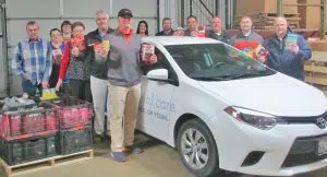 HSHS Home Care and Hospice Southern Illinois, Dan Hecht Chevrolet Toyota, Northside Ford Lincoln and Roy Schmidt Honda recently teamed up to “Cram the Car” with non-perishable food items for the Catholic Charities food pantry. This third annual food drive effort by the four organizations collected 1,580 pounds, filling four Home Care cars of food for the Catholic Charities Food Pantry. Shown left to right: John Arthur, Food Pantry Assistant for Catholic Charities; Valerie Engelbart, Volunteer Coordinator, HSHS Hospice Southern Illinois; Ashley Dillingham, Marketing Specialist, HSHS Home Care & Hospice Southern Illinois; Sr. Sandra Sudkamp, Pantry Coordinator for Catholic Charities; Kenny Birch and Michael Joliff, salespeople with Northside Ford; Jessika Pryor and Denny Ricketts, salespeople with Roy Schmidt Honda; Jason Webb, Chad Koester, and Doug Jackson, salespeople with Dan Hecht Chevrolet Toyota; and Bob Hecht, co-owner of Dan Hecht Chevrolet Toyota.