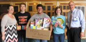 The Altamont High School Student Council recently collected over 380 items including mini hand sanitizer, individual packs of kleenex, coloring books and crayons to donate to pediatric patients at HSHS St. Anthony’s Memorial Hospital. Shown with some of the items donated are (left to right) are Teresa Lee, Special Education teacher and Student Council/Senior Class Advisor at Altamont High School, and students Hayden Voelker, Austin Wendling, and Brooke Stuckemeyer, along with Michael Wall, St. Anthony’s Director of Philanthropy.   