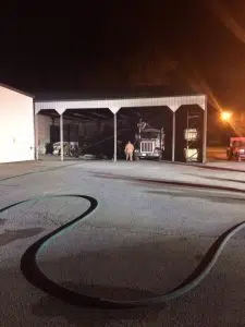 Fire crews investigate the source a fire at NOVA Office Furniture Monday night.