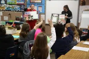 Ms. Davis’s third graders at Charleston’s Carl Sandburg School eagerly raise their hands for the opportunity to show off their dental knowledge to Lake Land College Dental Hygiene students Fallon Sullivan and Laura Koester.