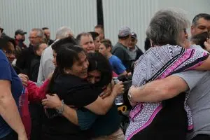 Lesi Santos (centre) is hugged as news breaks that the Santos family will be allowed to stay in Canada on June 22, 2017. (Kevin Weedmark/The World-Spectator)