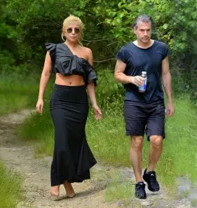 EXCLUSIVE: Lady Gaga maintains her personal style during a hike in the woods with her new boyfriend Christian Carino