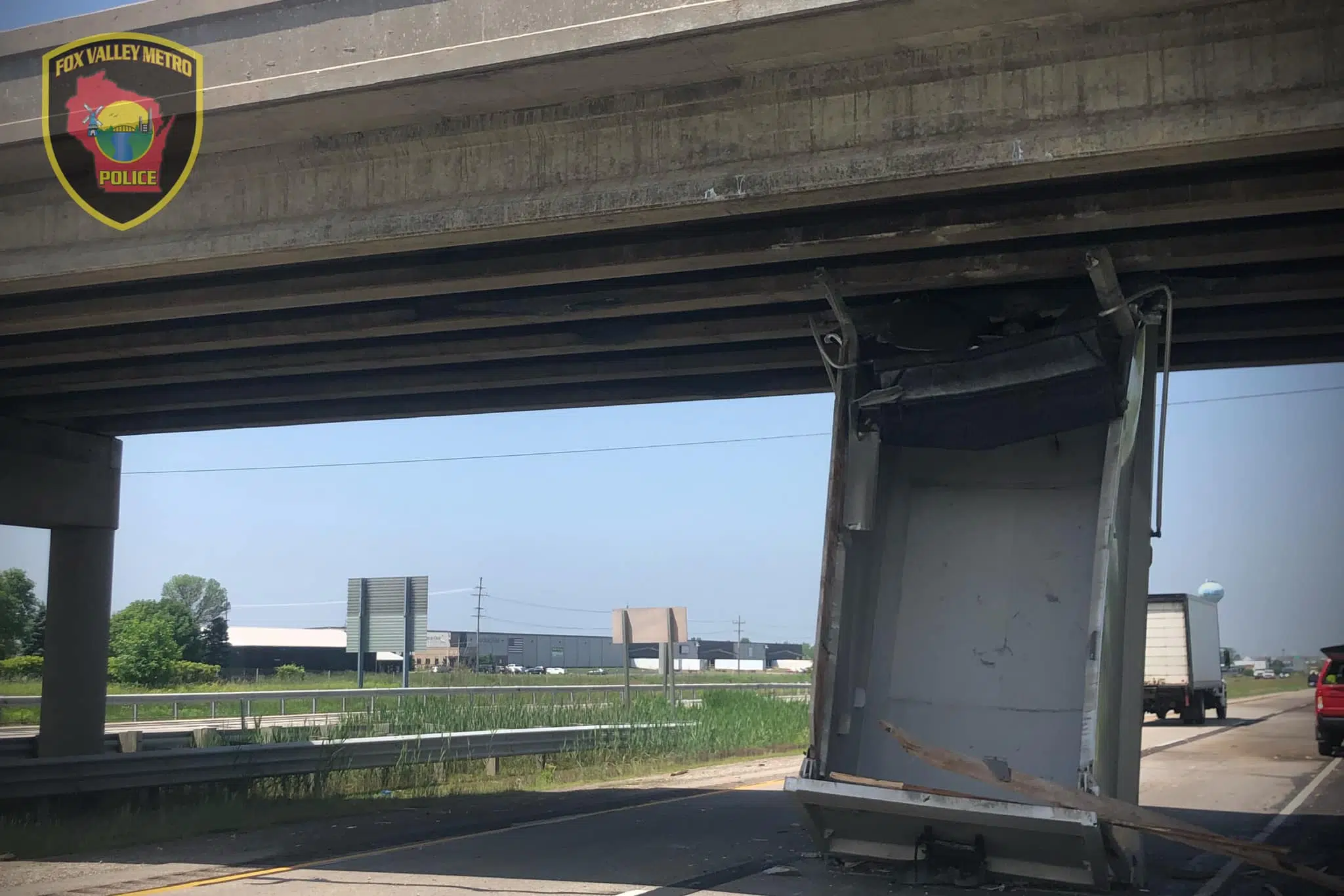 truck hits bridge today