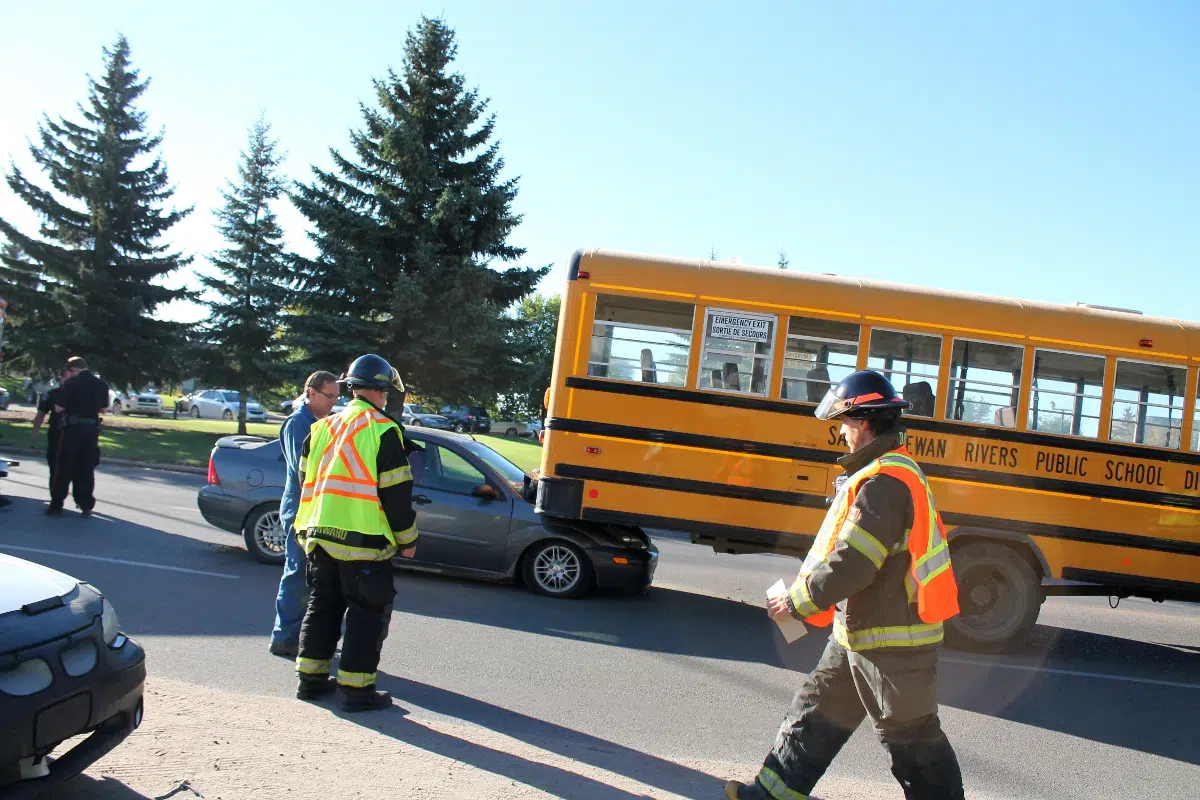 PHOTOS Car crashes into school bus in front of high school paNOW