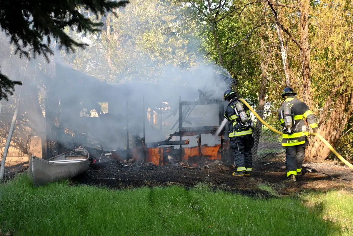 Backyard structure fire hits power lines | paNOW