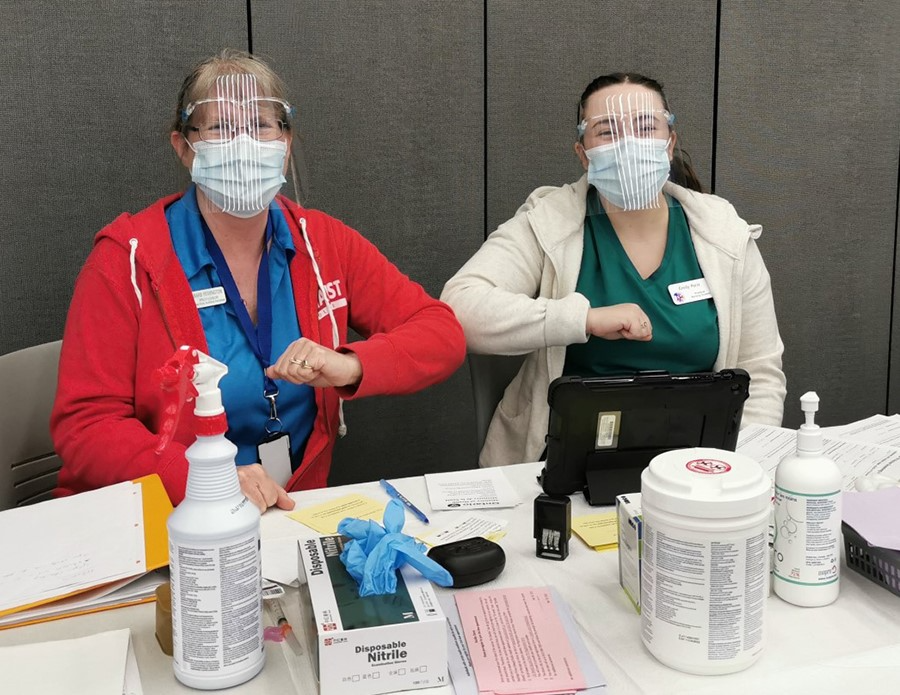 Loyalist College students helping to administer COVID-19 vaccines at the clinic on campus - Vimarsana News