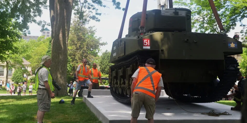 Workers lining up the tank in place