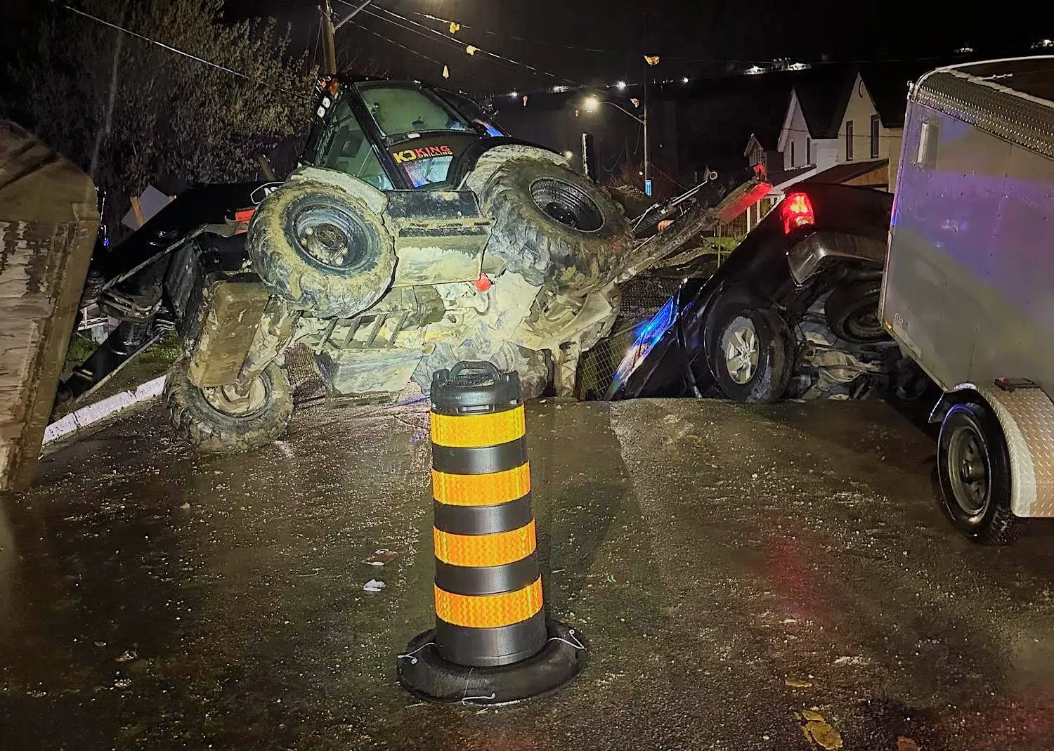 St. Thomas resident sends truck and excavator into 12 foot hole