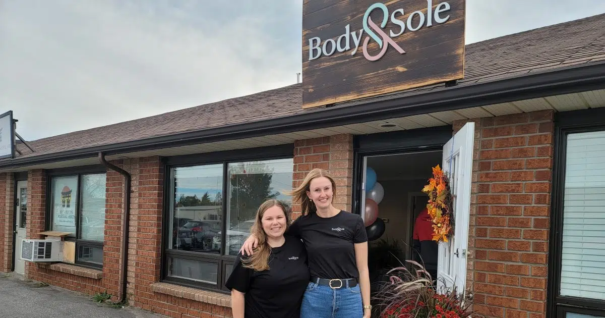 COMMUNITY SPOTLIGHT Brighton’s Body & Sole holding Boot and Shoe Drive