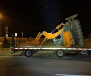 Semi hauling excavator hits I-65 bridge over U.S. 31