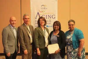 (L-R: Danny Maxson, Community Innovation/WellCare, Health Plans, Teresa Lorenz, Deputy Director, Thrive Alliance, Mark Lindenlaub, Executive Director, Thrive Alliance, Christina Rajanayakam, Program Director, Thrive Alliance, and Kathy Boles, n4a President)
