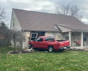 Pickup crashes into house