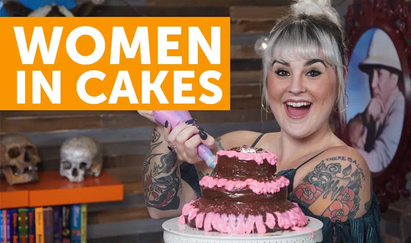 women jumping out of cakes