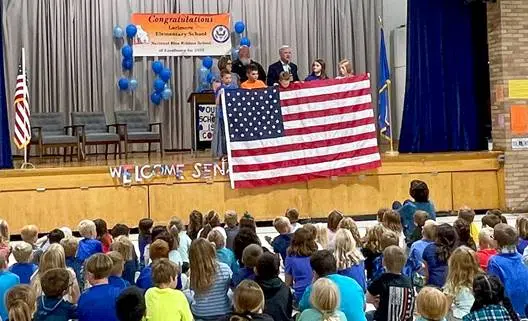 Hoeven presents US flag to honored Larimore school – KNOX Radio