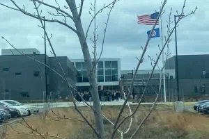Sartell High School students gather at the flagpole