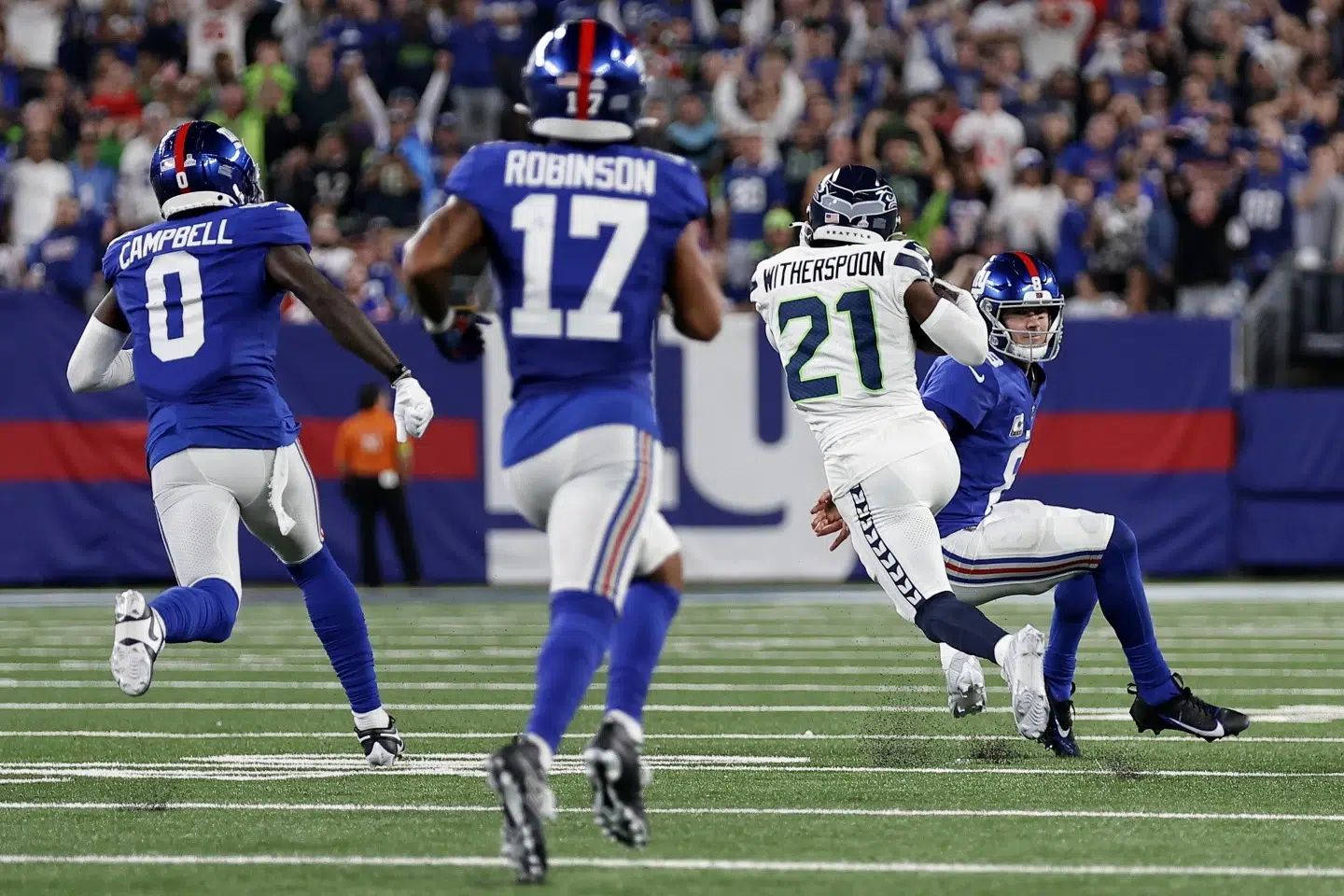 Rookie Devon Witherspoon scores on 97-yard pick six as Seahawks D leads  Seattle over Giants, The Mighty 790 KFGO