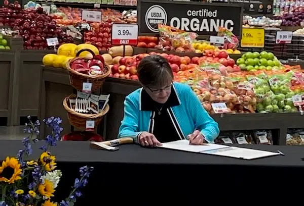 Kansas governor signs bill gradually eliminating state’s sales tax on groceries