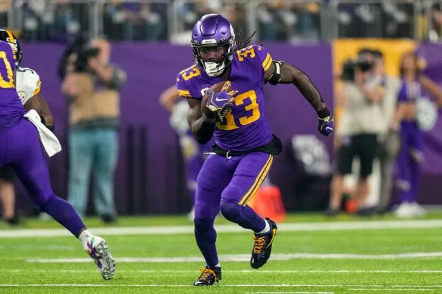 Minnesota Vikings running back Dalvin Cook (33) runs into the end zone for  a touchdown during