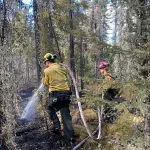 Alberta wildland firefighting crews extinguished hotspots