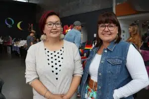 Vanessa Ruptash (Left) and Frances Whitford (Right) from I.AM Collective inside the Indigenous Art Market at the Art Gallery of Alberta (Photo Credits - Daniel Barker-Tremblay)