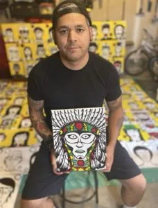 Artist Johnny Bandura in front of his 215 artwork (Photo Credits - Johnny Bandura)