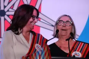 MNA President Andrea Sandmaier and former MNA president Audrey Poitras at the Otipemisiwak Métis Government Swearing-in Ceremony