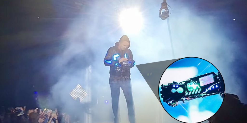 Matt Bellamy plays a glove synthesizer during Muse's headlining set at Isle of Wight Festival - Vimarsana News