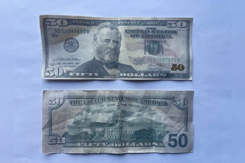Moose Jaw police searching for two suspects using counterfeit American currency