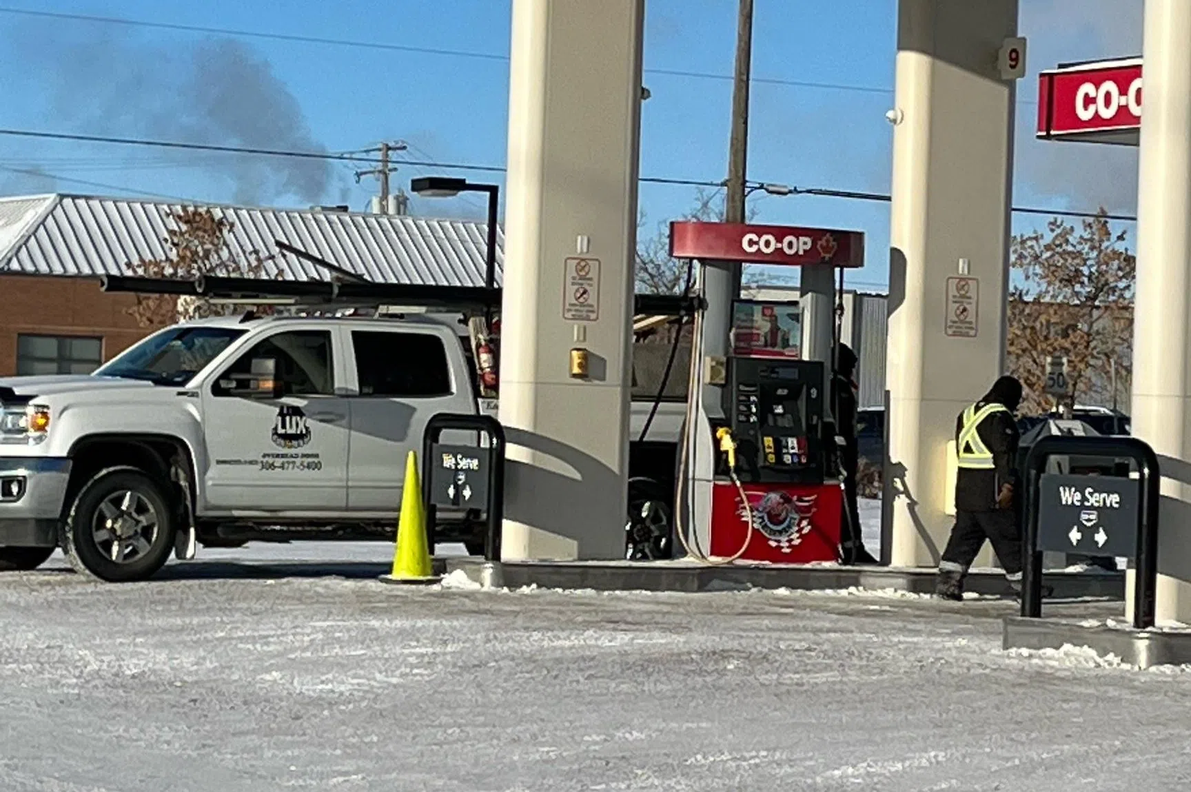 Gas attendants layer up to brace for cold weather
