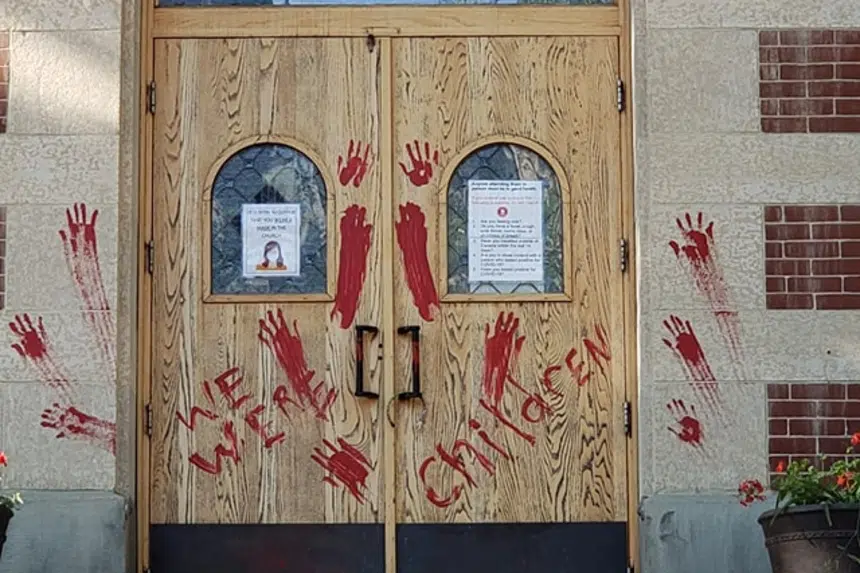 Doors, steps of Saskatoon Catholic cathedral covered with paint