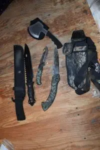 Knives, a machete and hatchet seized during a raid in La Ronge.