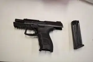 A gun and magazine seized in a raid in La Ronge